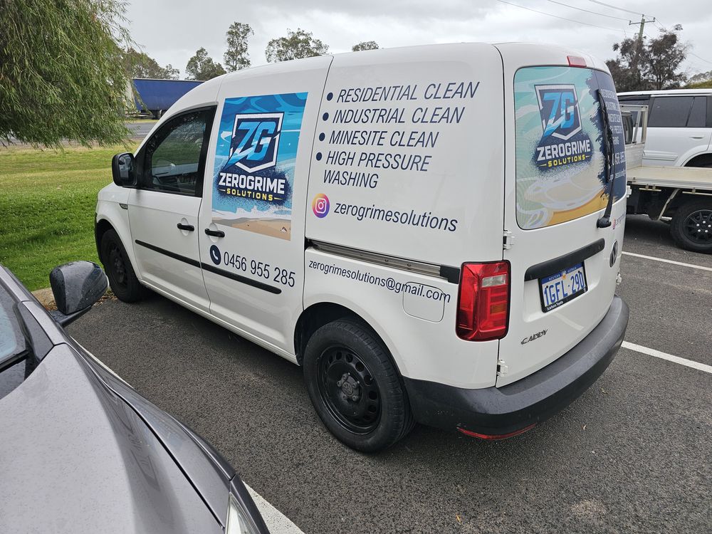 Rear three quarter view of the ZeroGrime Solutions van showing contact details and the ZG logo