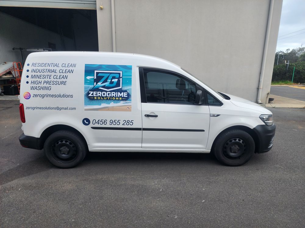 Side view of the signwritten ZeroGrime Solutions van, listing residential, industrial, minesite and high pressure cleaning